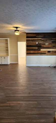 a view of room with wooden floor