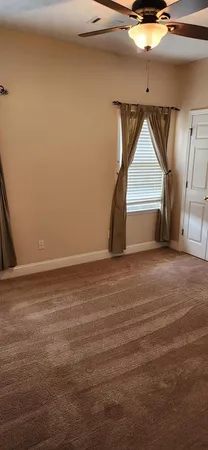 a view of a hallway with windows