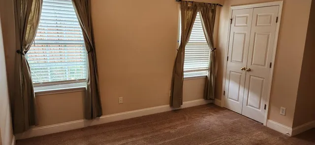 a view of a hallway with windows