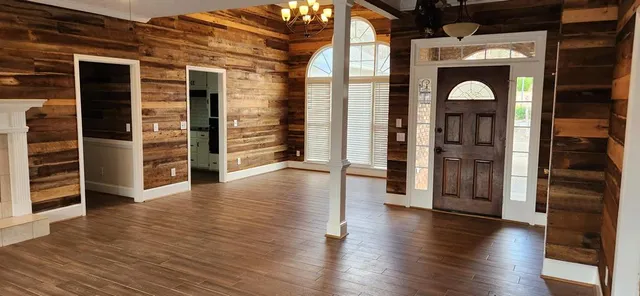 a view of a livingroom with furniture and wooden floor