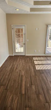 a view of a kitchen space with wooden floor