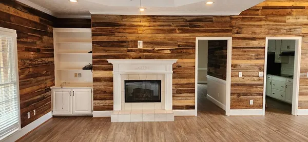 a view of a livingroom with wooden floor