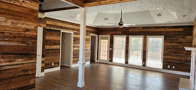 a view of an entryway with wooden floor