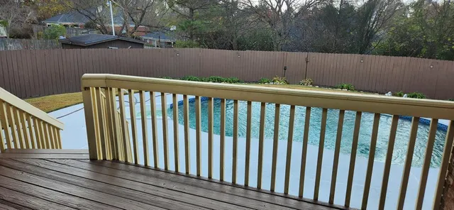 a view of a balcony with wooden floor