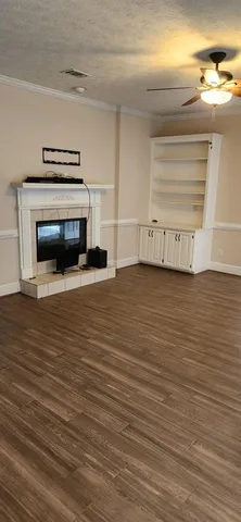 a view of a livingroom with an empty space and a fireplace