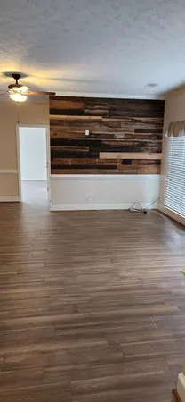 a view of room and wooden floor