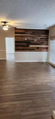 a view of room and wooden floor
