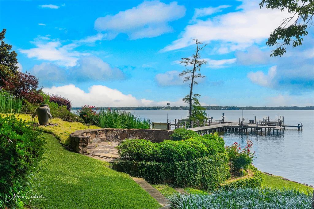 3045 Risinger Drive Shreveport, LA 71119 - Photo 7 of 40 Rounded stone platform with privacy hedges for enjoying unparalleled long views of Cross Lake.