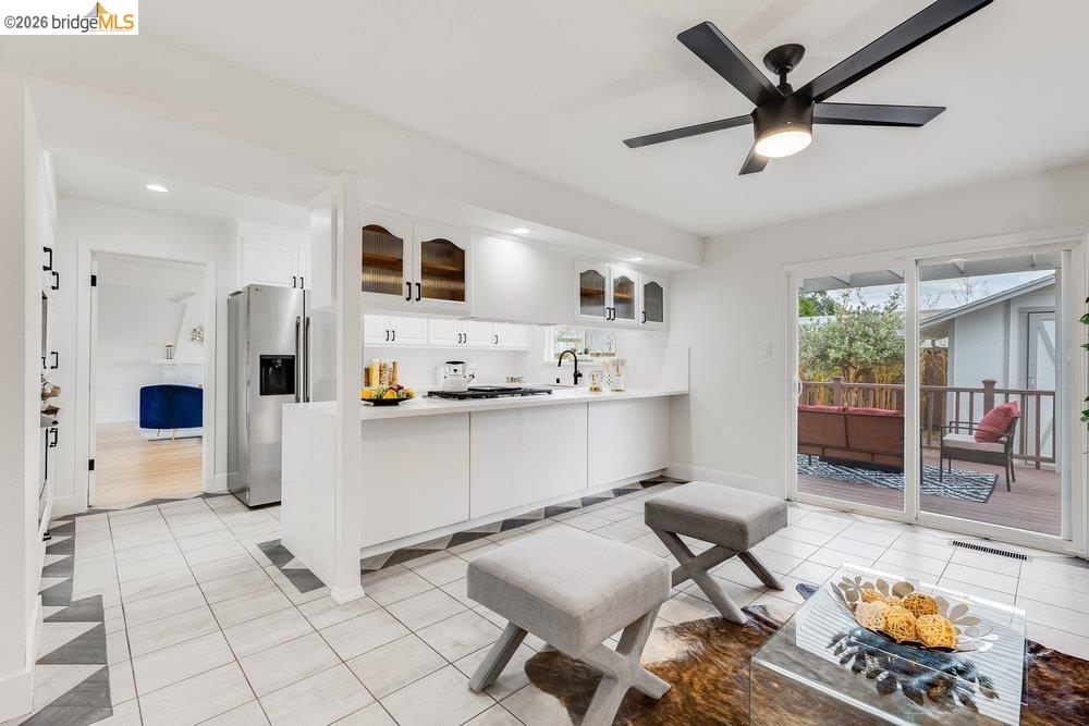 1298 Ribbon Street Foster City, CA 94404 - Photo 36 of 86 Modern kitchen featuring white cabinetry, stainless steel appliances, and a white countertop