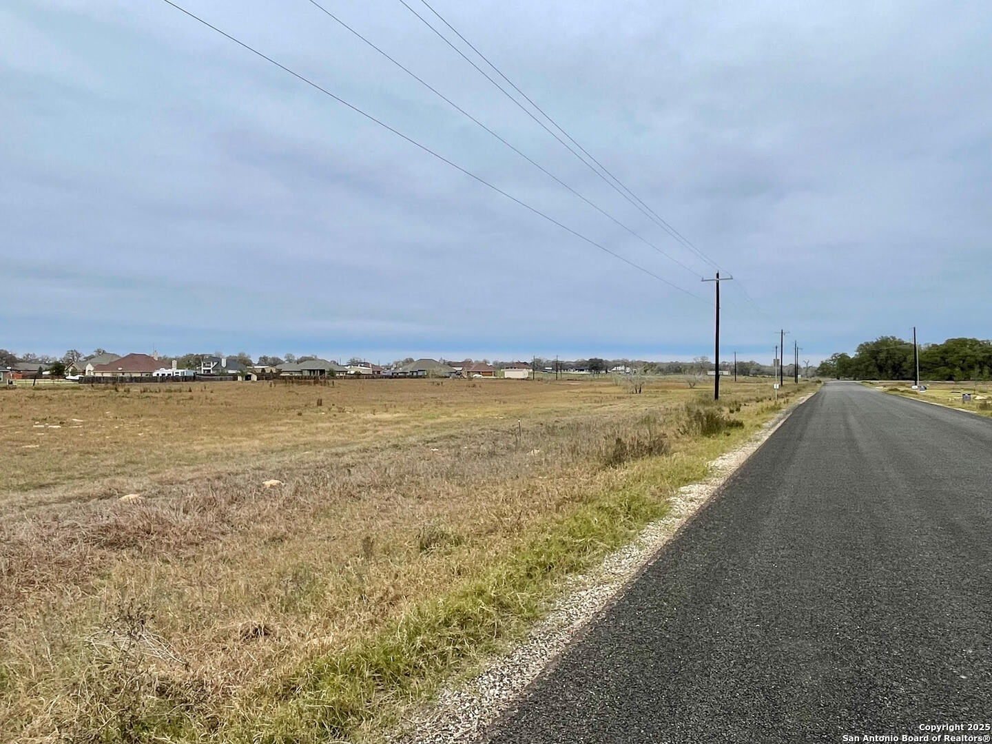 100 Pradera Rdg Drive Floresville, TX 78114 - Photo 15 of 17 a view of a large body of water with a building in the background