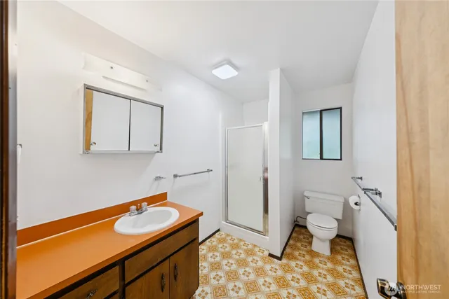 a bathroom with a sink and a toilet