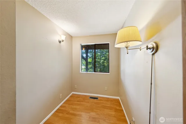 a view of a room with window and a table