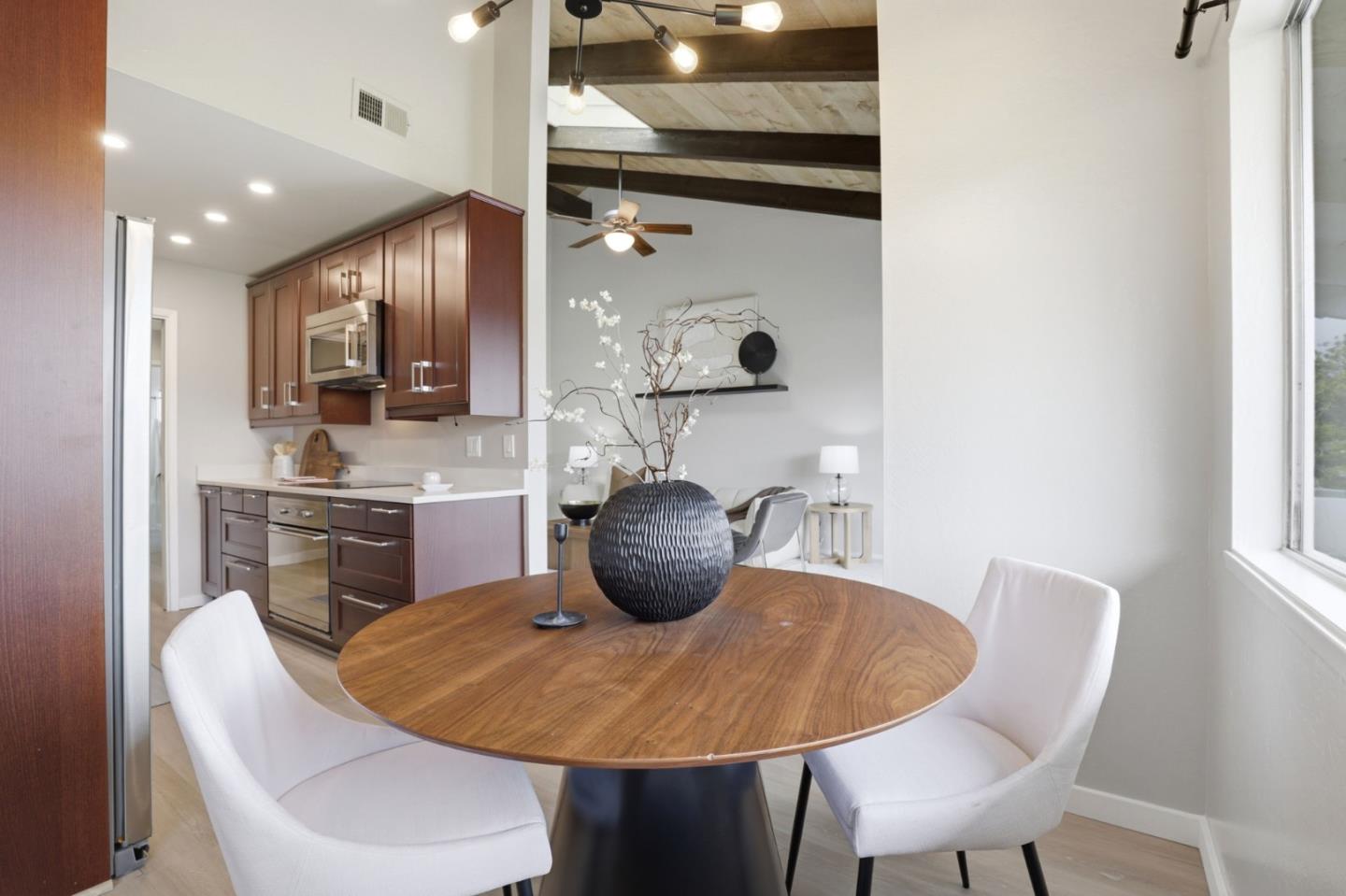 255 South Rengstorff Avenue, Unit 2 Mountain View, CA 94040 - Photo 10 of 25 a kitchen with a table and chairs
