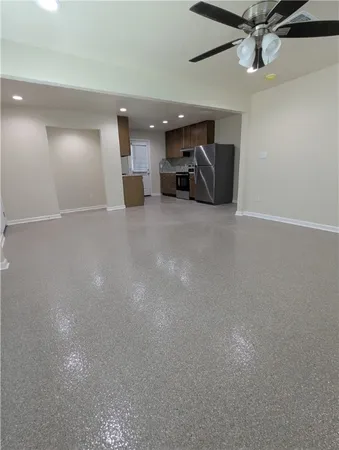 a view of storage and utility room with a ceiling fan