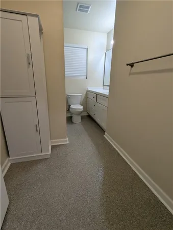 a view of a room that has a bed in it