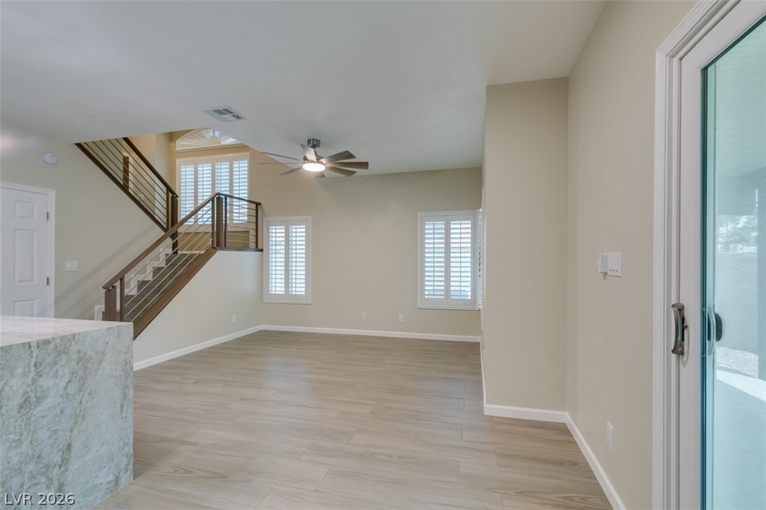 540 Sutters Mill Road Henderson, NV 89014 - Photo 26 of 46 This bright and airy living space features beautiful flooring and a stylish staircase.