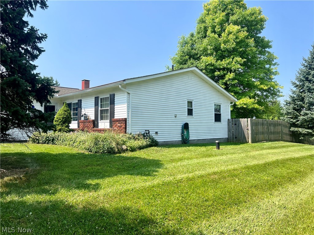10071 Hazelton Road Streetsboro, OH 44241 - Photo 2 of 16 View of property exterior featuring a yard