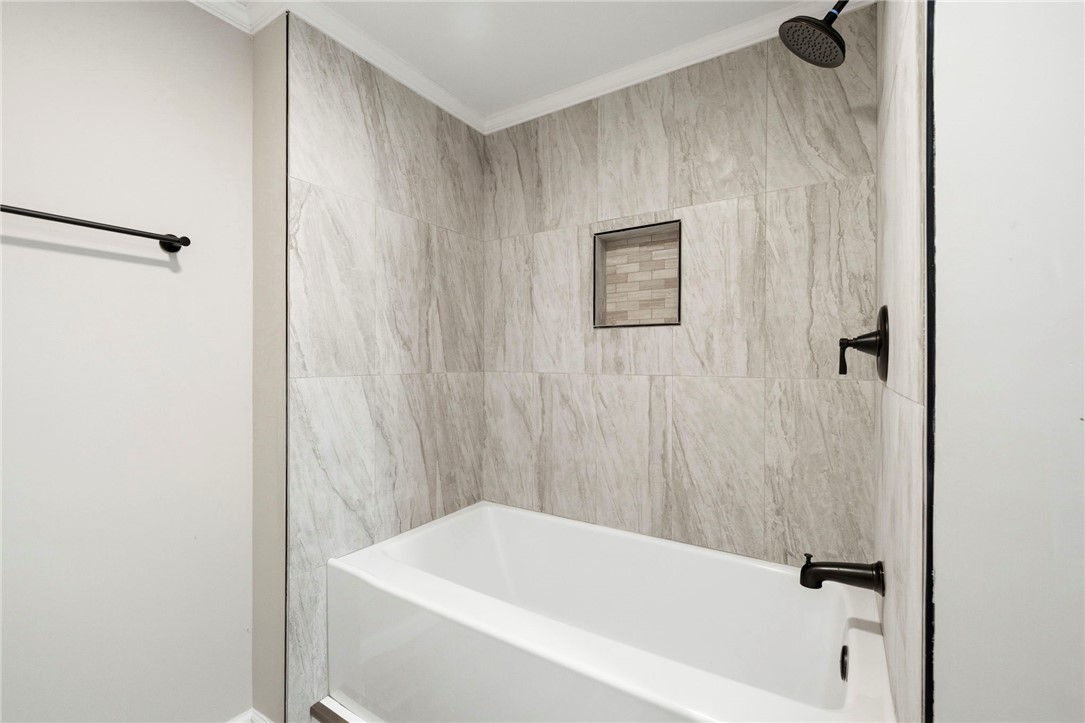 418 Old River Road Pelzer, SC 29669 - Photo 17 of 29 A pristine bath and shower area features elegant tile work and modern fixtures.
