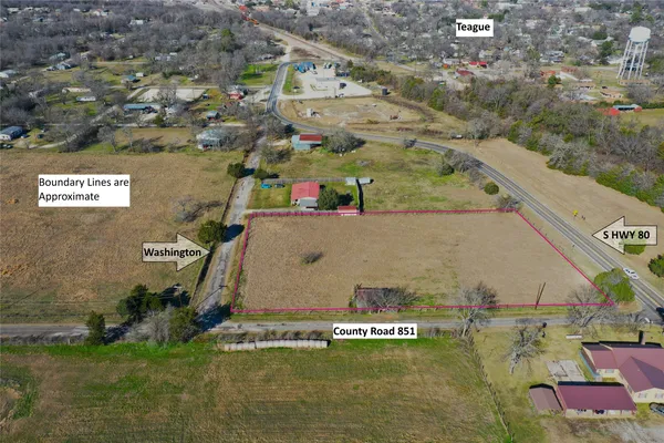 an aerial view of a house with a swimming pool