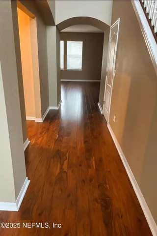 a view of entryway with wooden floor