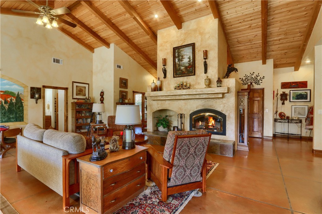 1087 Ben Hur Road Raymond, CA 93653 - Photo 12 of 75 a living room with furniture and a fireplace