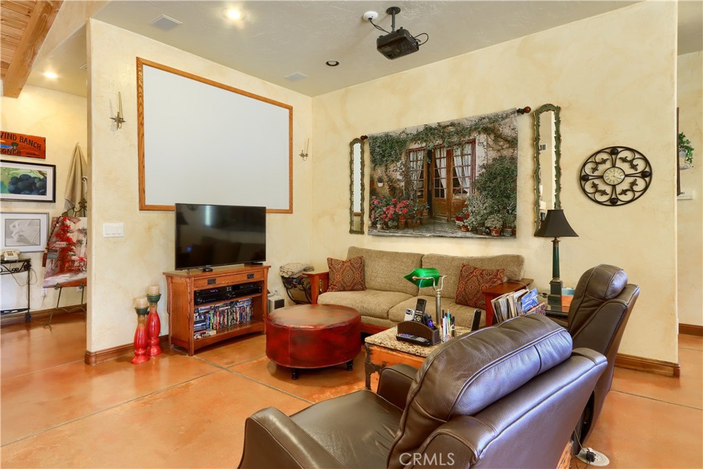 1087 Ben Hur Road Raymond, CA 93653 - Photo 16 of 75 a living room with furniture and a flat screen tv