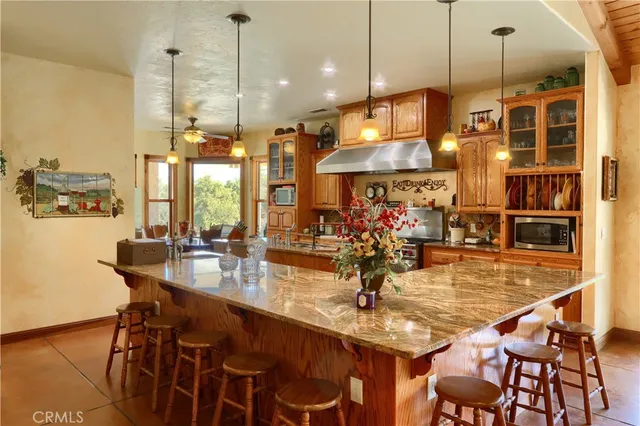 a kitchen with stainless steel appliances refrigerator and cabinets