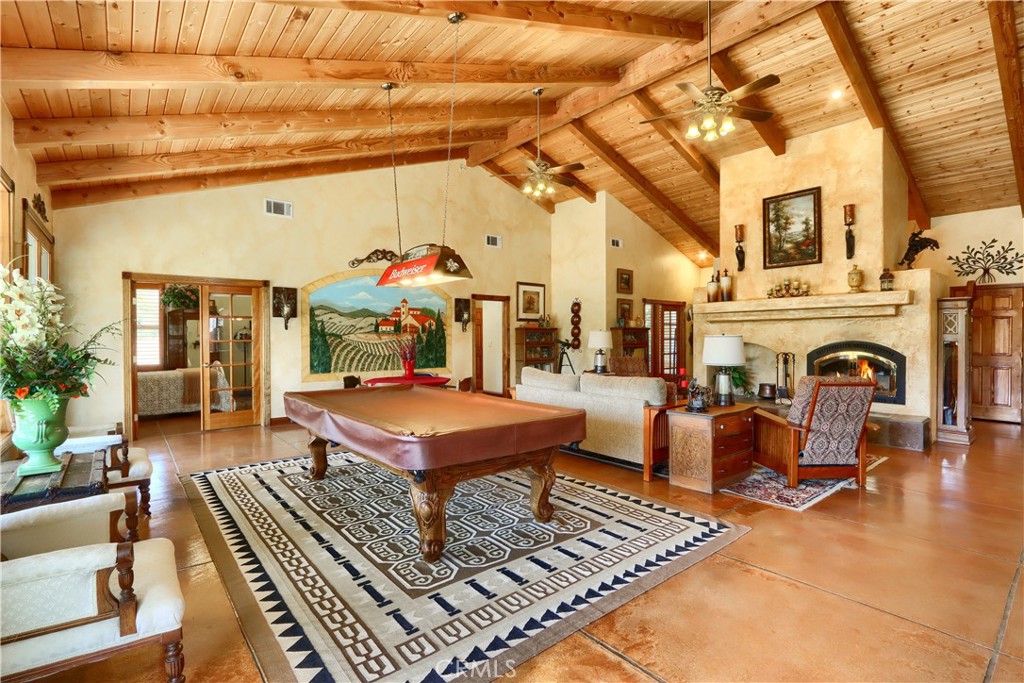 1087 Ben Hur Road Raymond, CA 93653 - Photo 2 of 75 a living room with furniture a rug and a fireplace