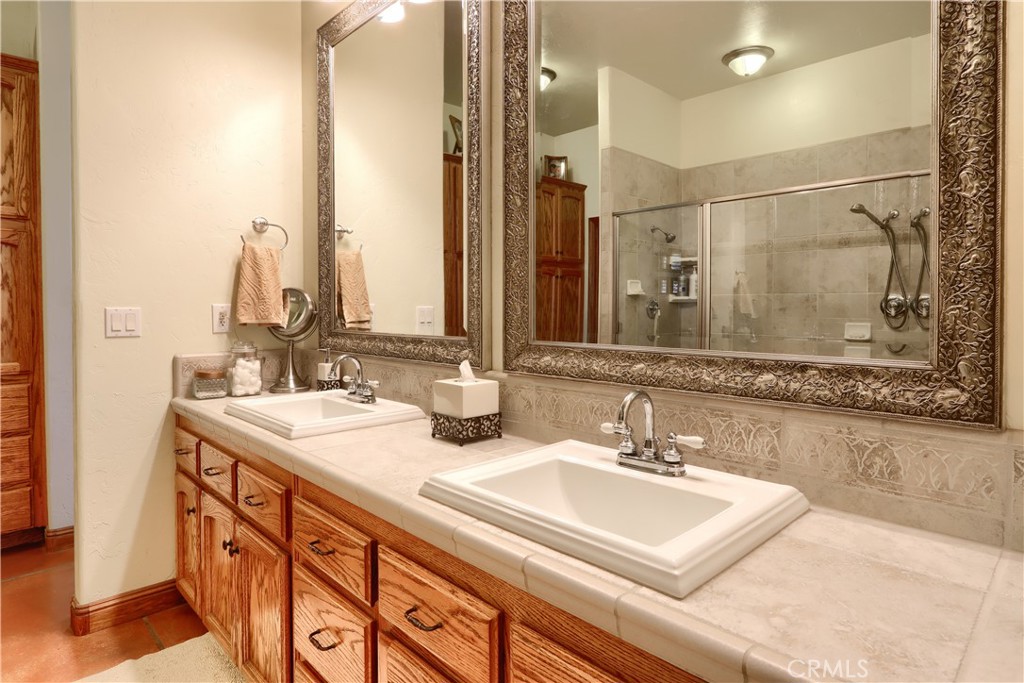 1087 Ben Hur Road Raymond, CA 93653 - Photo 30 of 75 a bathroom with a sink and a mirror