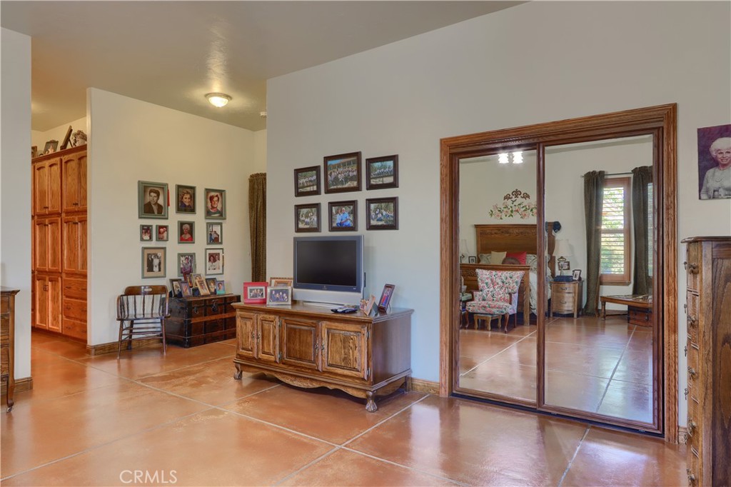 1087 Ben Hur Road Raymond, CA 93653 - Photo 31 of 75 a living room with furniture and a flat screen tv