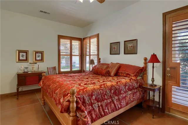 a view of a patio with table and chairs and potted plants