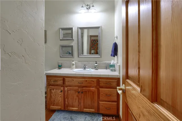 a view of a house with garden and sitting area