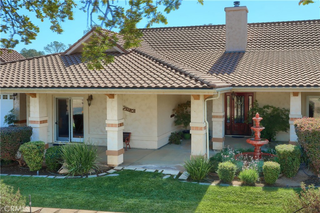 1087 Ben Hur Road Raymond, CA 93653 - Photo 39 of 75 a front view of a house with a garden