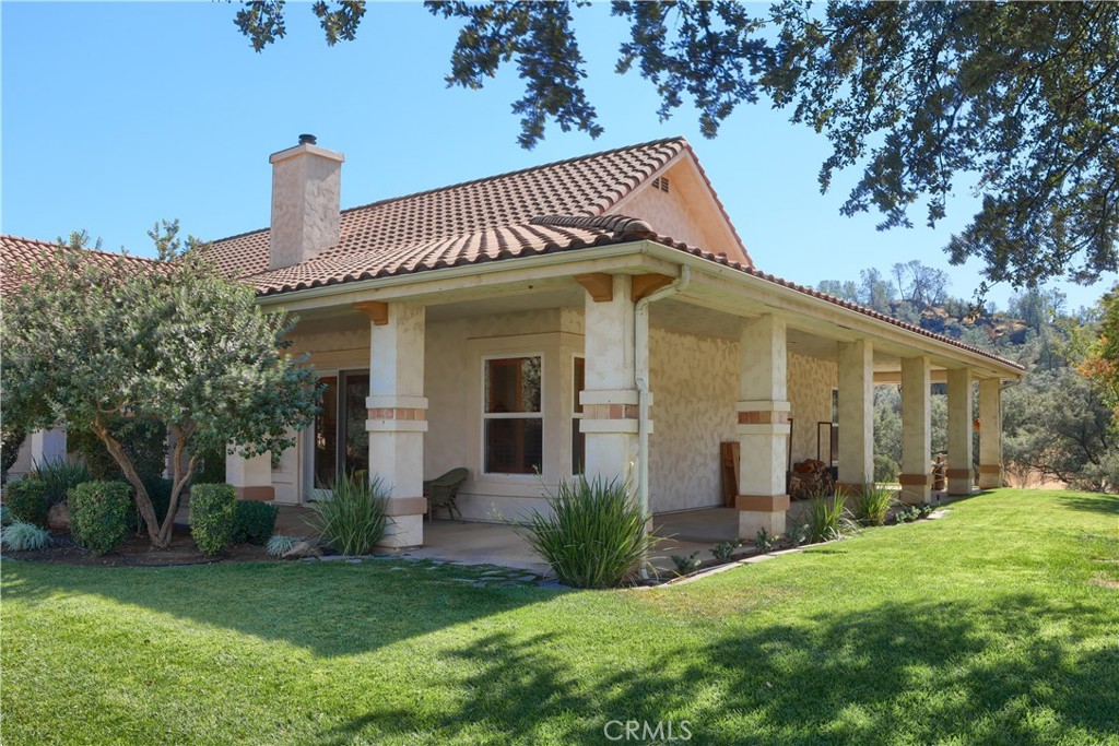 1087 Ben Hur Road Raymond, CA 93653 - Photo 43 of 75 a front view of a house with a yard
