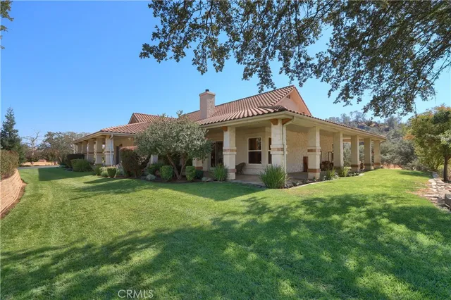an aerial view of a house with outdoor space