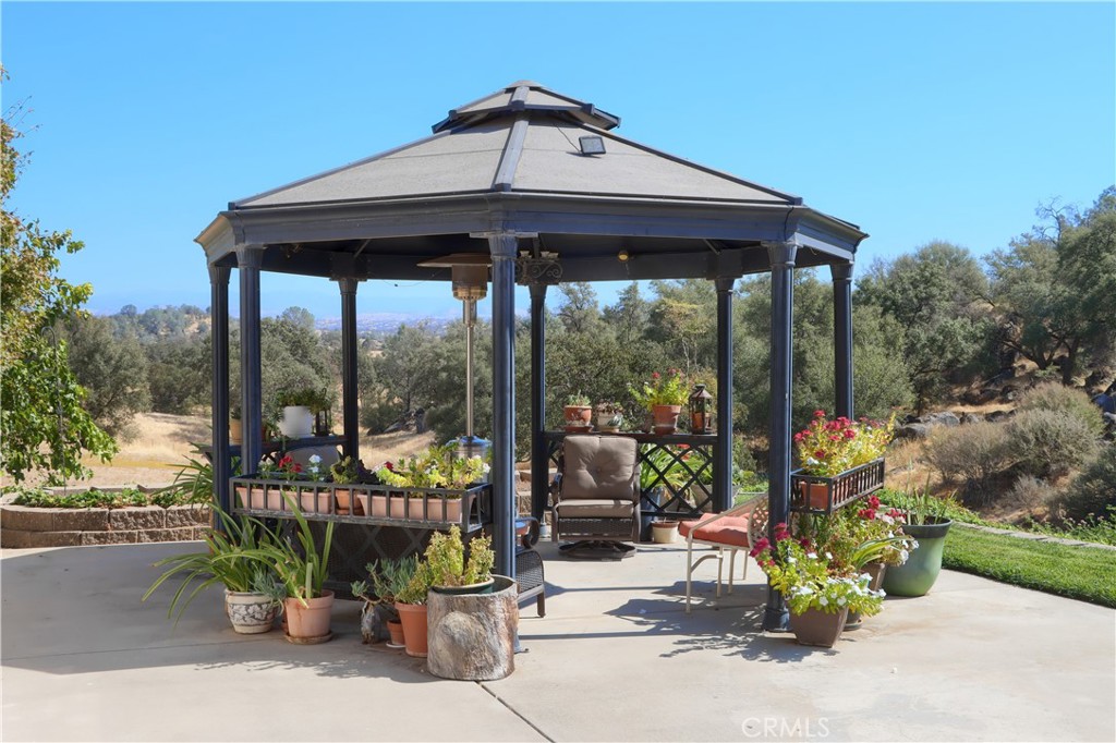 1087 Ben Hur Road Raymond, CA 93653 - Photo 53 of 75 a view of a chairs and table in the patio