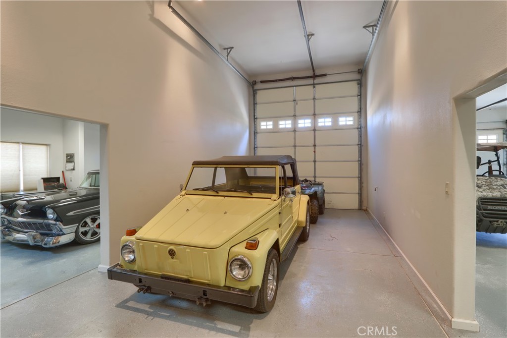 1087 Ben Hur Road Raymond, CA 93653 - Photo 63 of 75 a car parked in a room next to a window