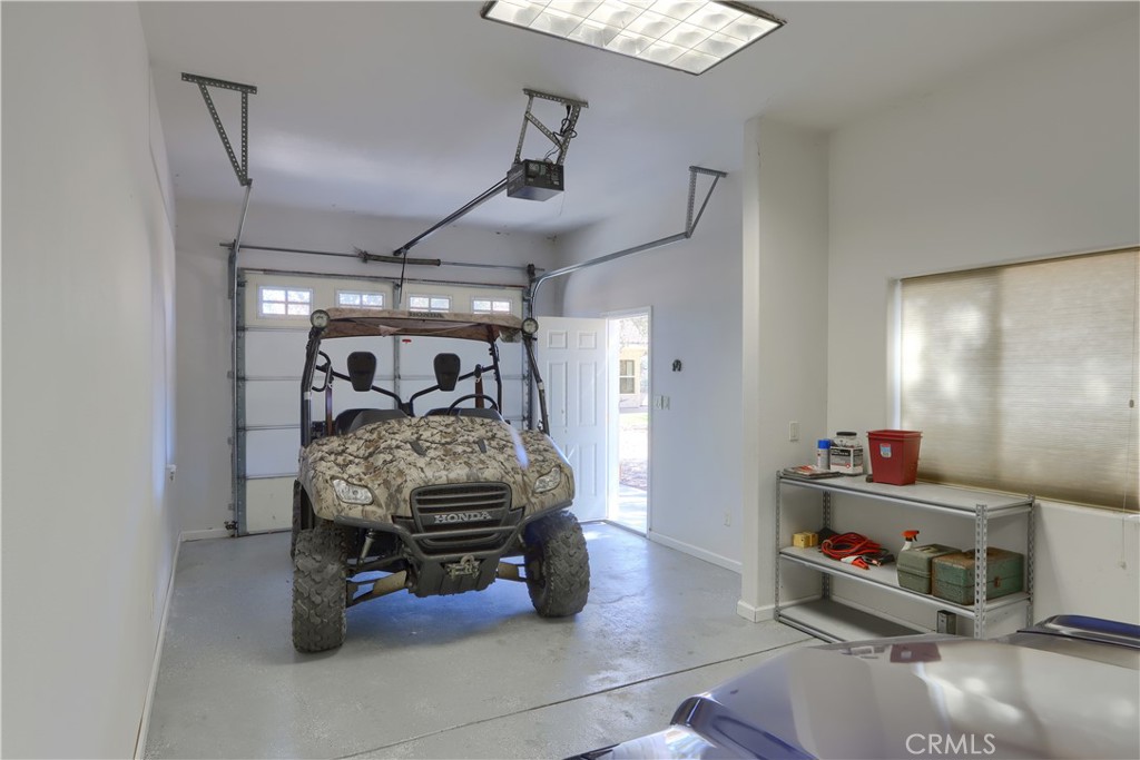 1087 Ben Hur Road Raymond, CA 93653 - Photo 65 of 75 a bed room with furniture and a chandelier