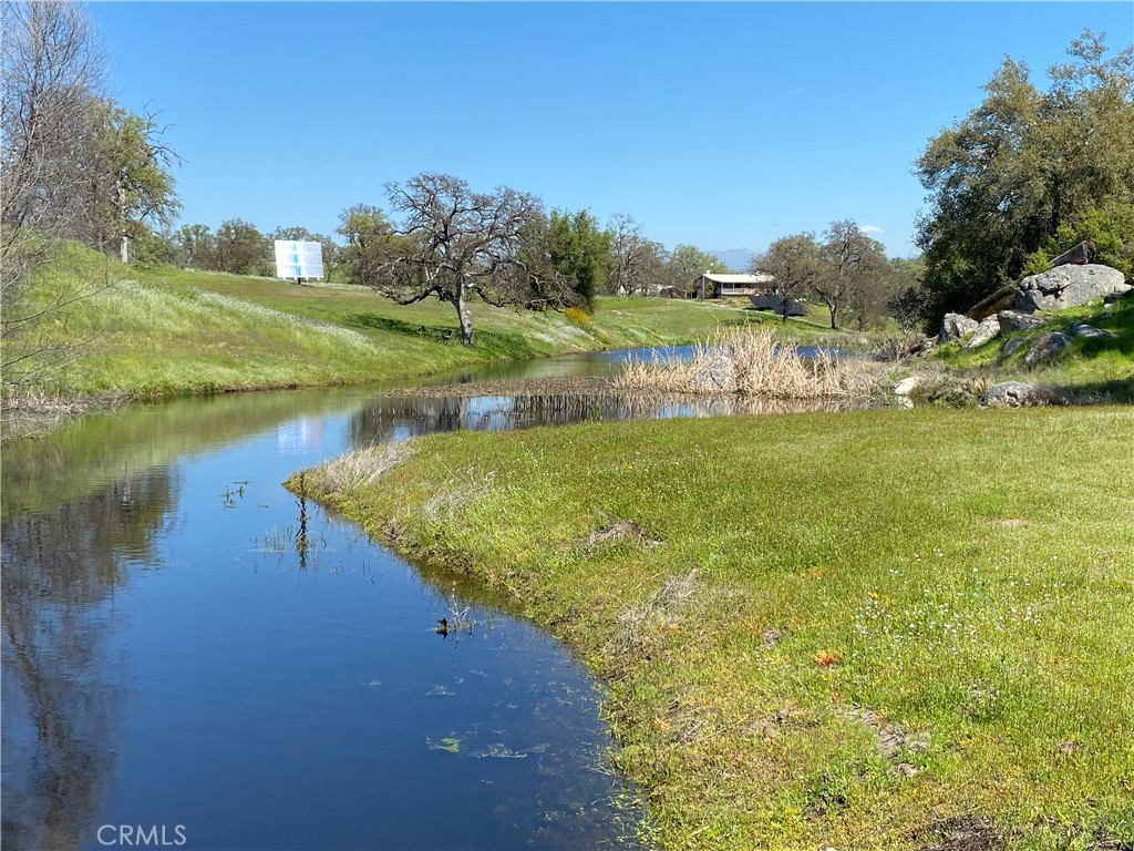 1087 Ben Hur Road Raymond, CA 93653 - Photo 8 of 75 a view of a lake with a yard