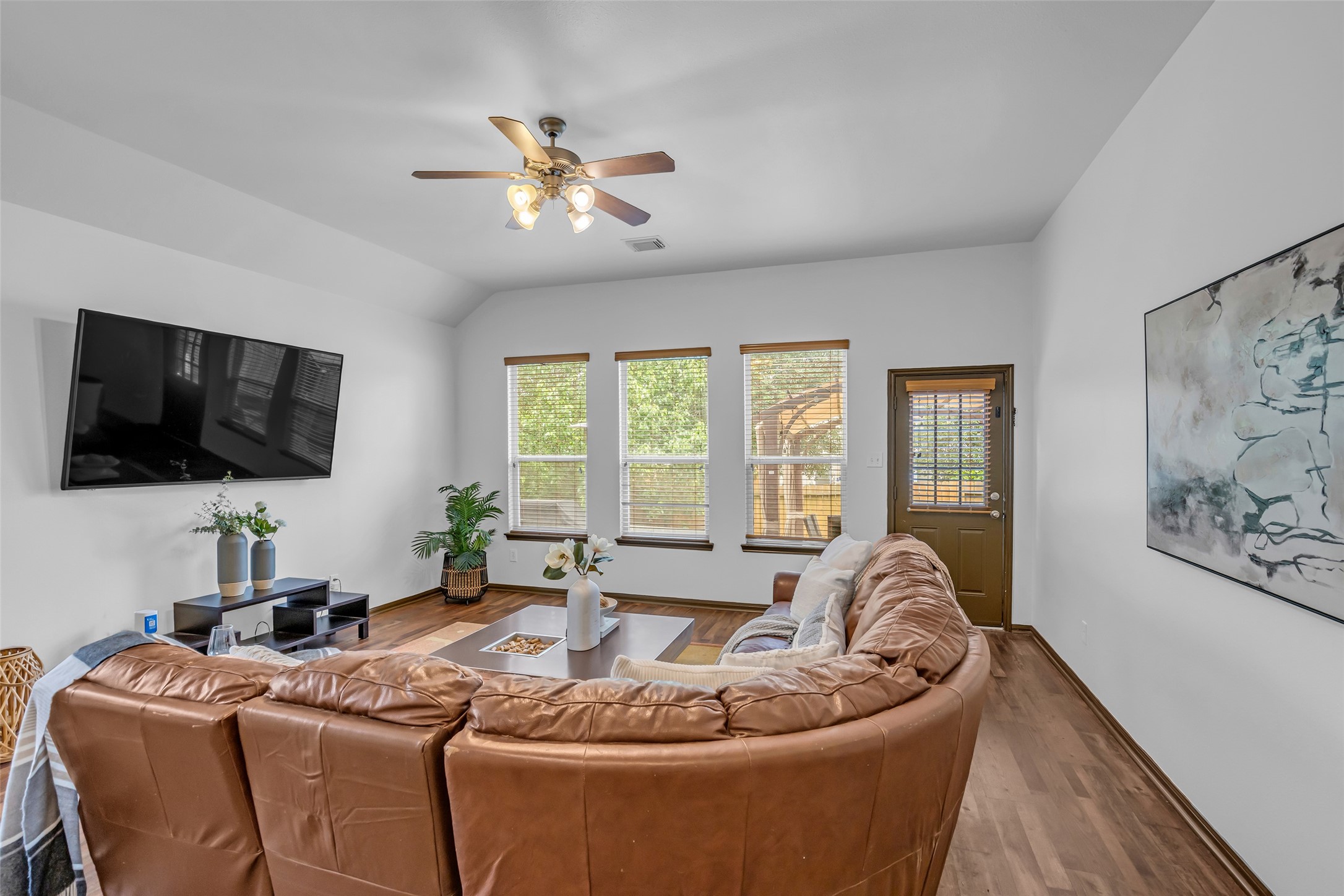 134 South Star Ridge Circle The Woodlands, TX 77382 - Photo 11 of 29 a living room with furniture and a flat screen tv