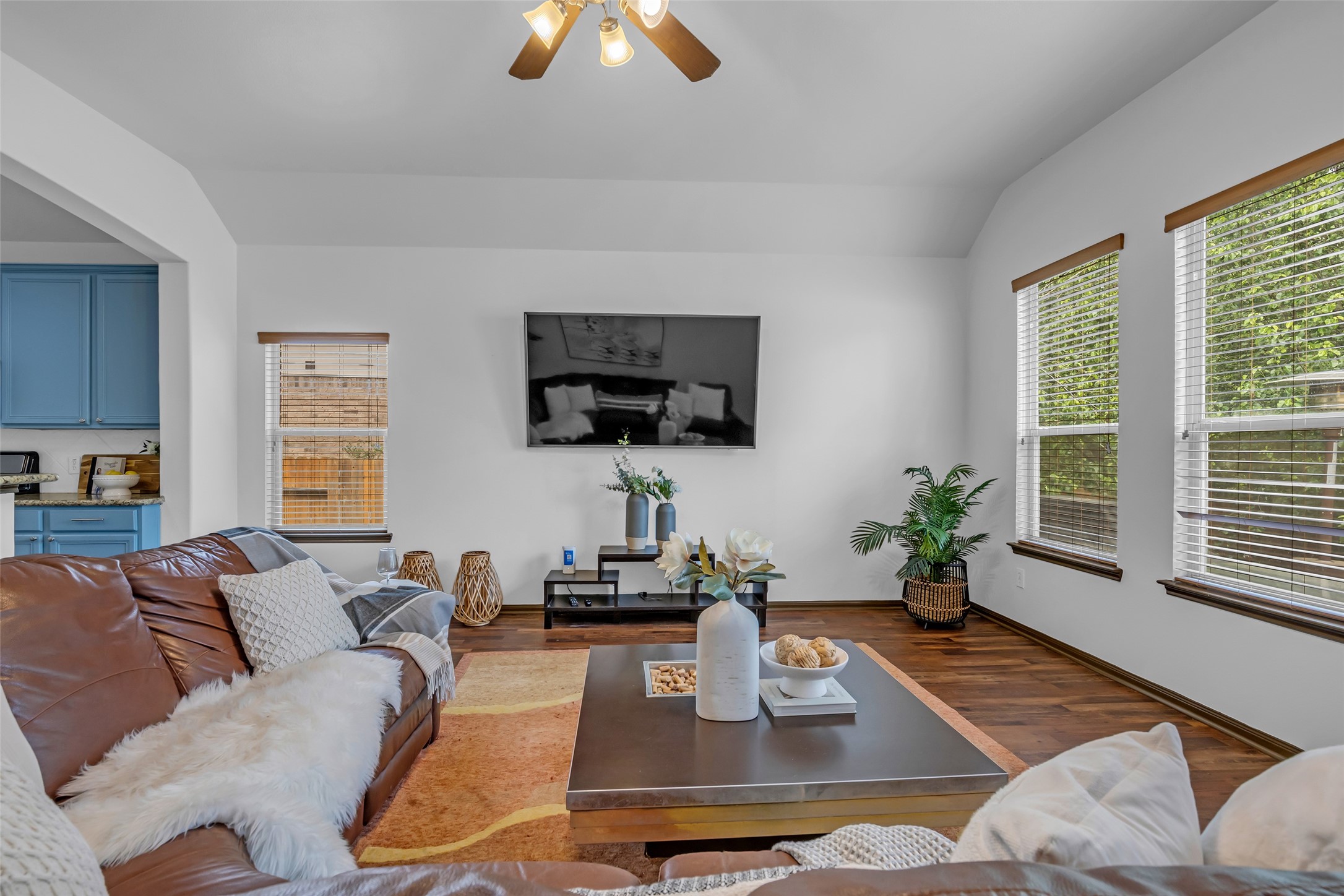 134 South Star Ridge Circle The Woodlands, TX 77382 - Photo 12 of 29 a living room with furniture a flat screen tv and a large window