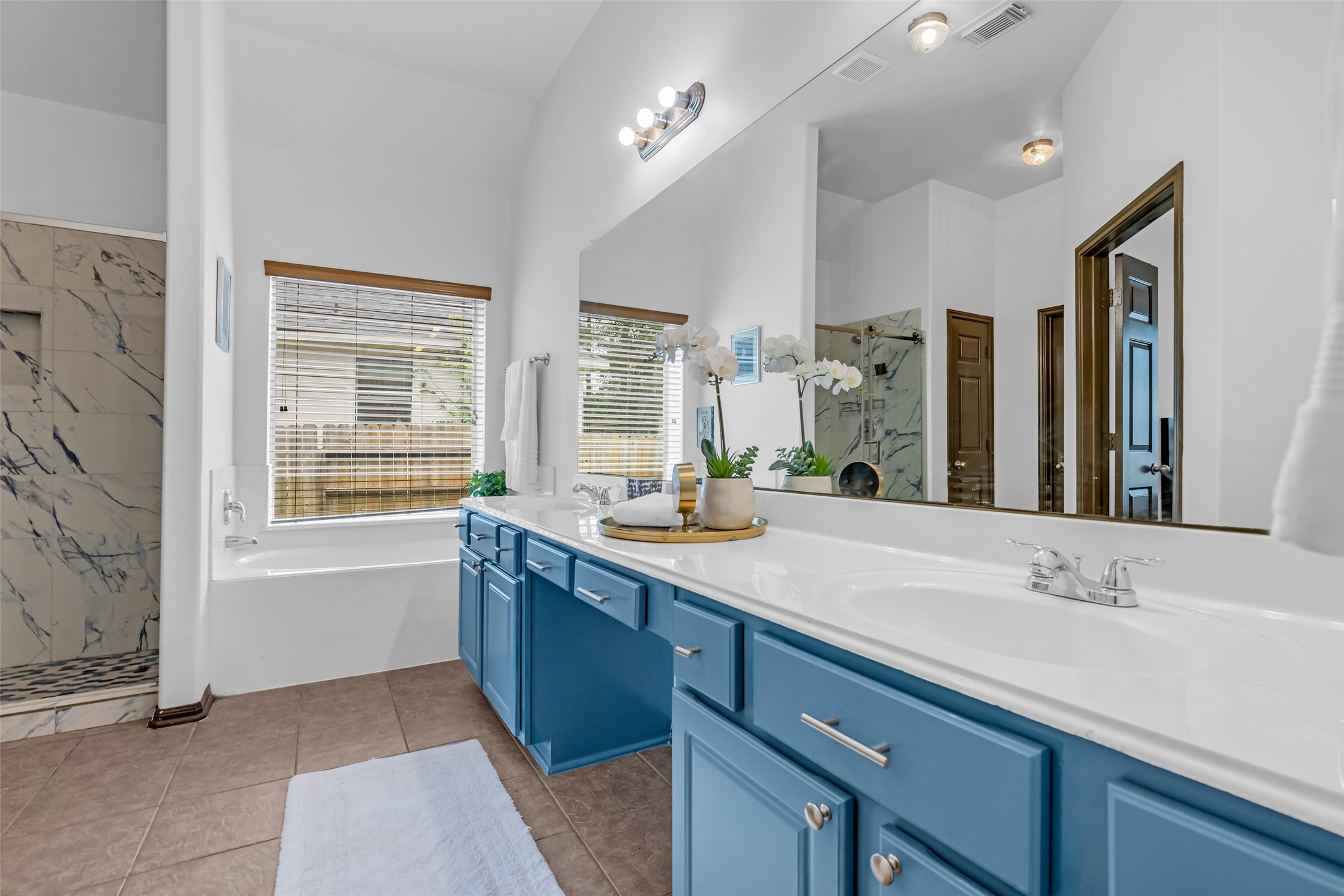 134 South Star Ridge Circle The Woodlands, TX 77382 - Photo 17 of 29 a bathroom with a granite countertop sink mirror and double