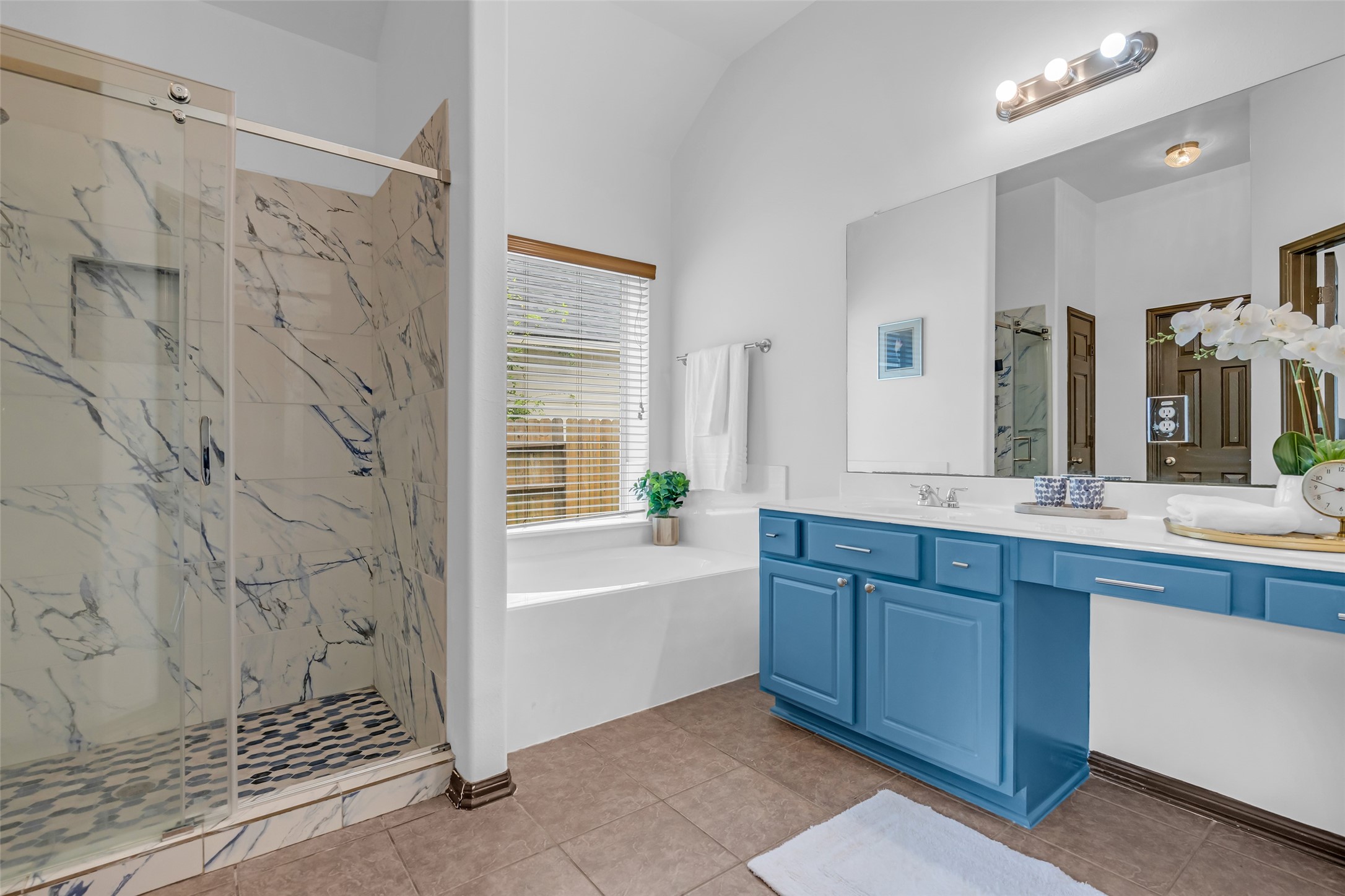 134 South Star Ridge Circle The Woodlands, TX 77382 - Photo 18 of 29 a bathroom with a bathtub sink vanity granite and a shower