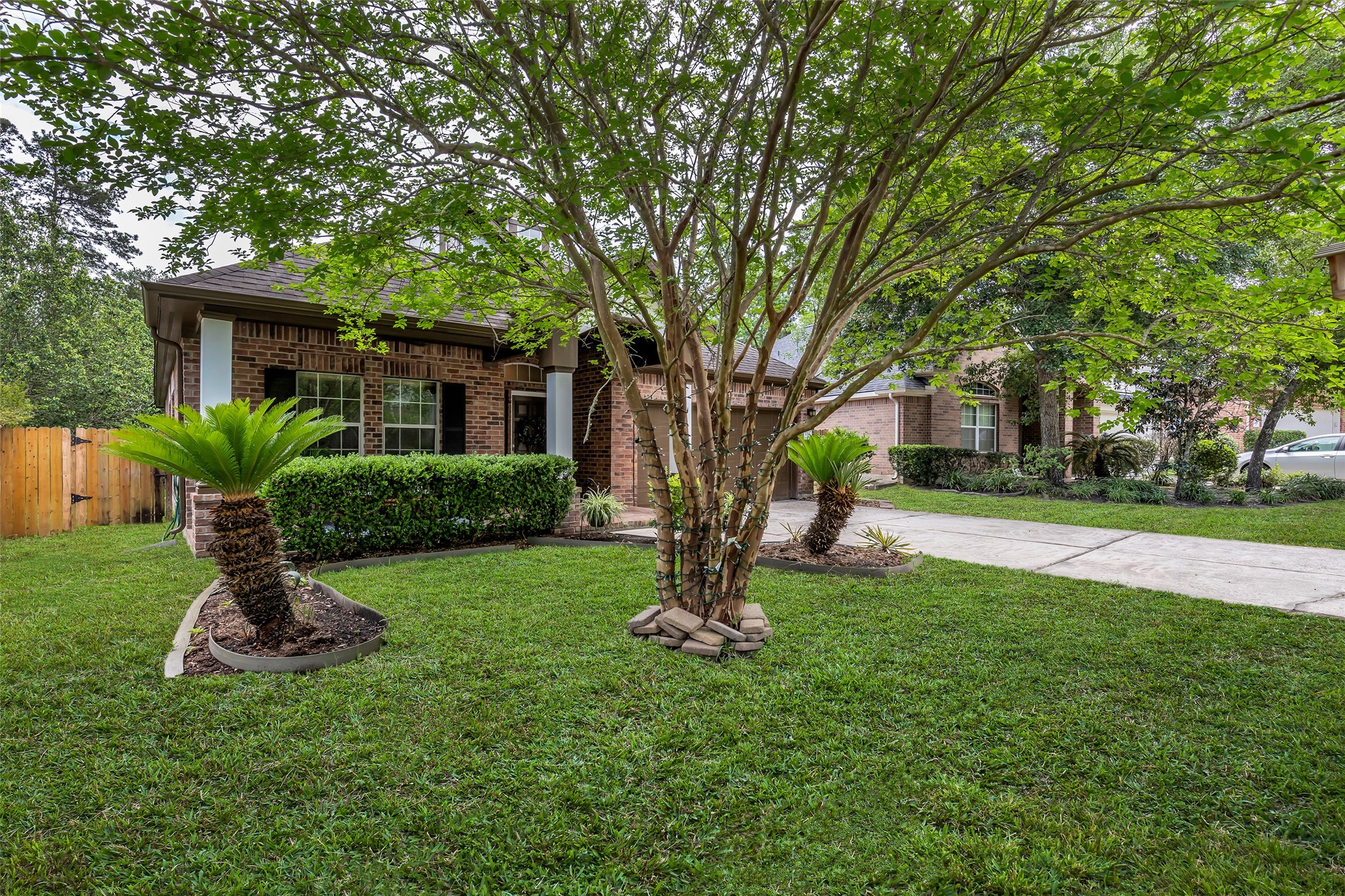 134 South Star Ridge Circle The Woodlands, TX 77382 - Photo 2 of 29 a view of a house with a backyard