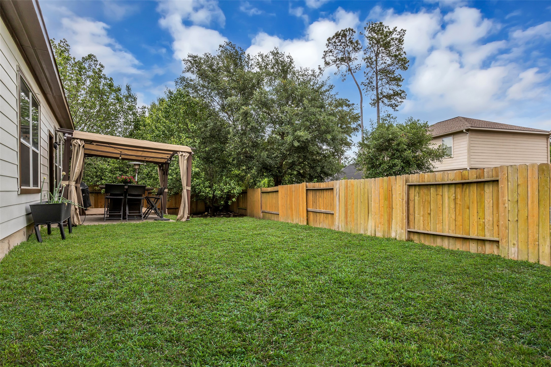 134 South Star Ridge Circle The Woodlands, TX 77382 - Photo 24 of 29 a front view of a house with garden