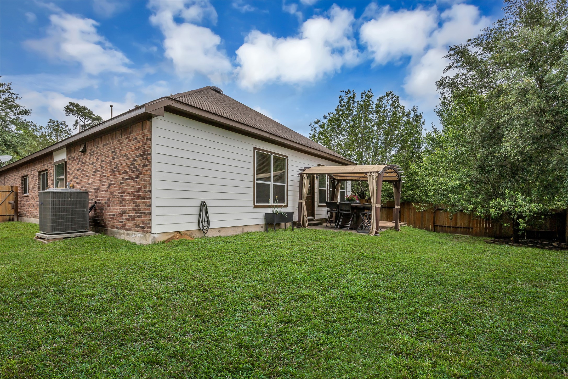 134 South Star Ridge Circle The Woodlands, TX 77382 - Photo 25 of 29 a front view of house with yard and green space