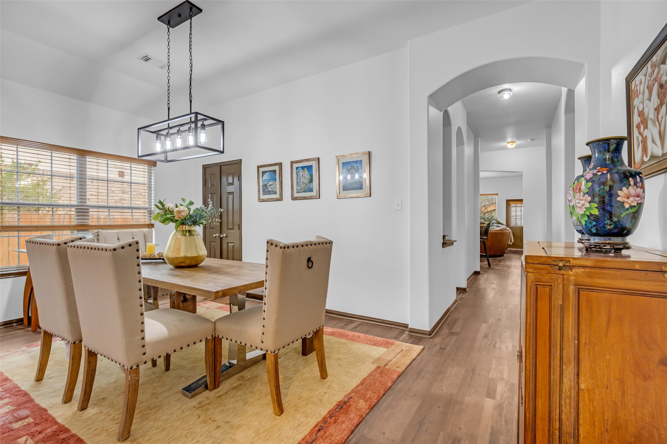 134 South Star Ridge Circle The Woodlands, TX 77382 - Photo 4 of 29 a view of a dining room with furniture window and wooden floor
