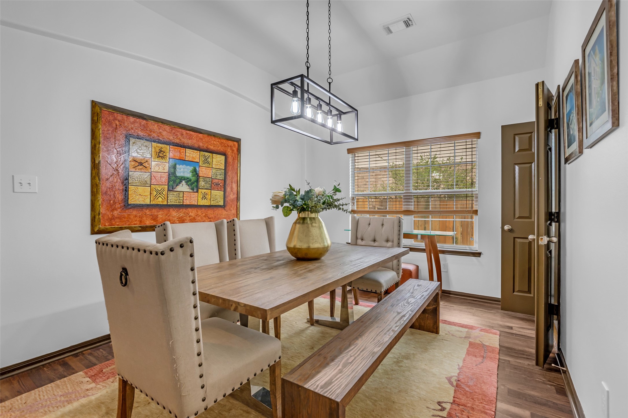 134 South Star Ridge Circle The Woodlands, TX 77382 - Photo 5 of 29 a view of a dining room with furniture a chandelier and wooden floor