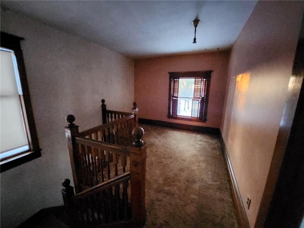 364 Kinsman Road Jamestown, PA 16134 - Photo 16 of 22 a view of a hallway with wooden floor and stairs
