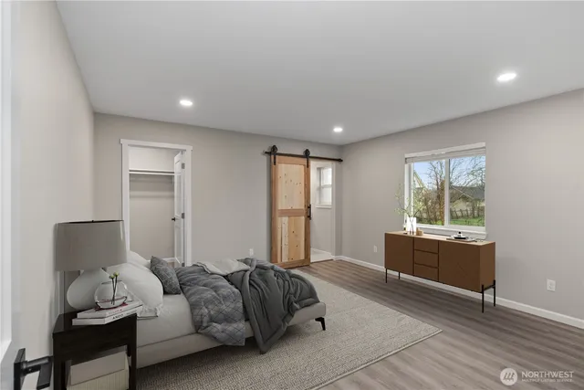 a bed room with furniture and a window